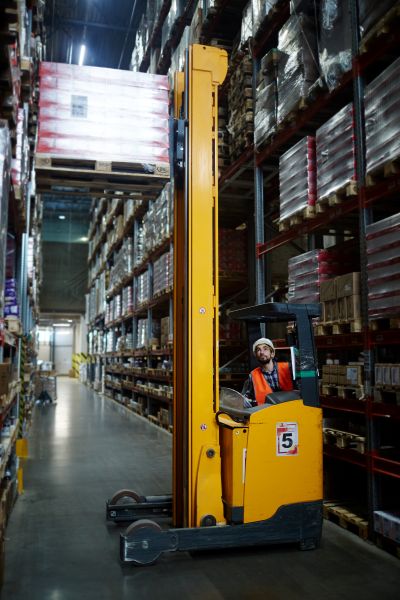 man with forklift in warehouse