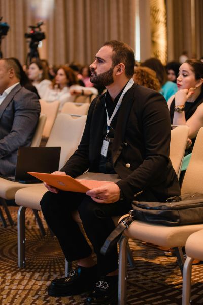 Attendees sitting in a conference venue room