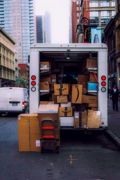 delivery van full of boxes of Amazon parcels