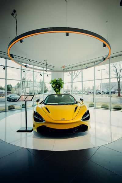 car-showroom400x600 Yellow sports car in car showroom