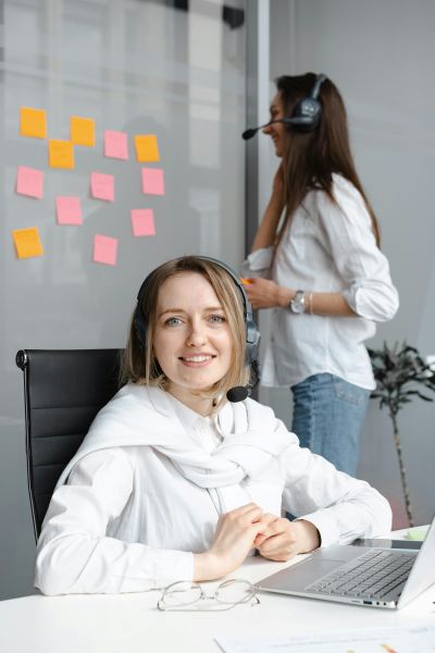 customer-service-400×600 Young customer service woman in office with headset
