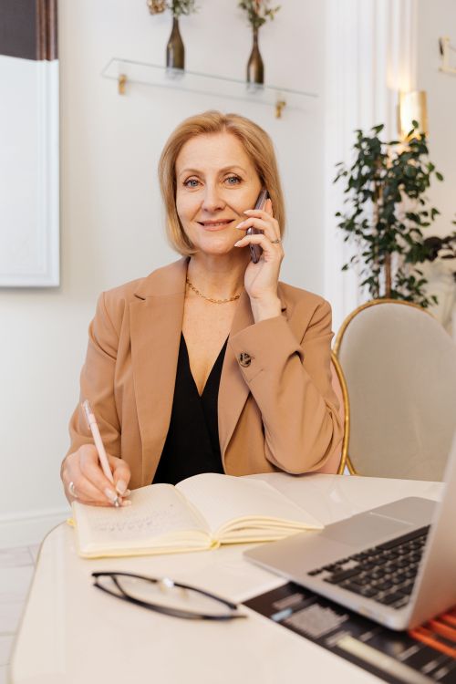 Female consultant at her desk on the phone