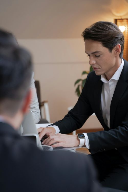 professional in suit on laptop